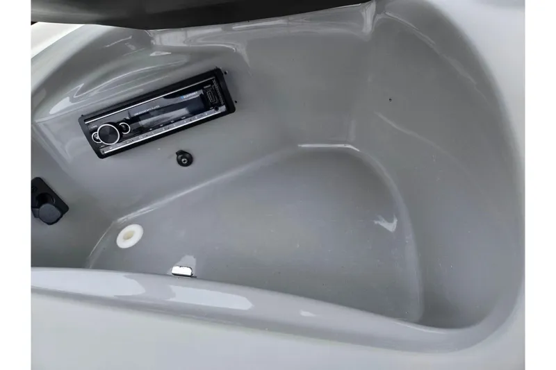 Slide: The Image of 2011 Bayliner 195 boat interior with built-in stereo system. - 15