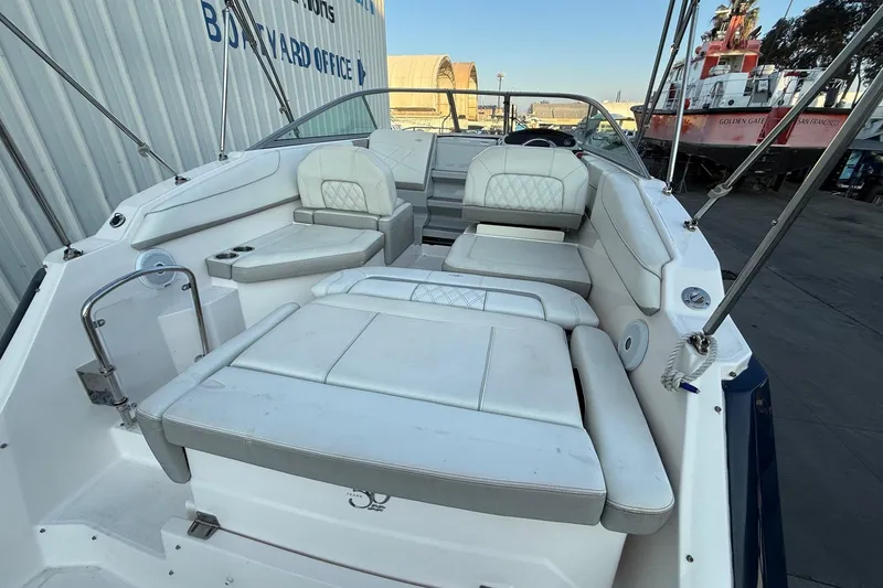 Slide: The Image of 2020 Regal 26 XO boat interior with white seating and modern design. - 11