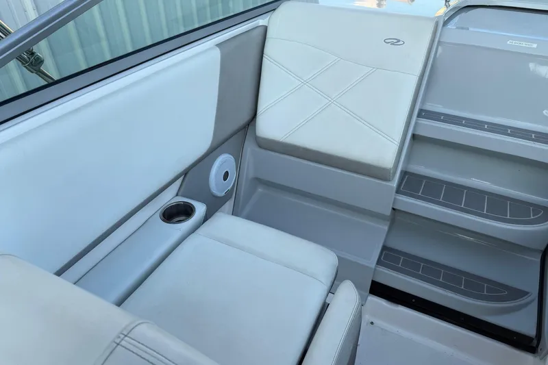 Slide: The Image of Interior seating of 2020 Regal 26 XO boat with cup holder and speaker. - 16