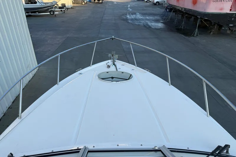 Slide: The Image of 2020 Regal 26 XO boat bow view in a marina setting. - 18
