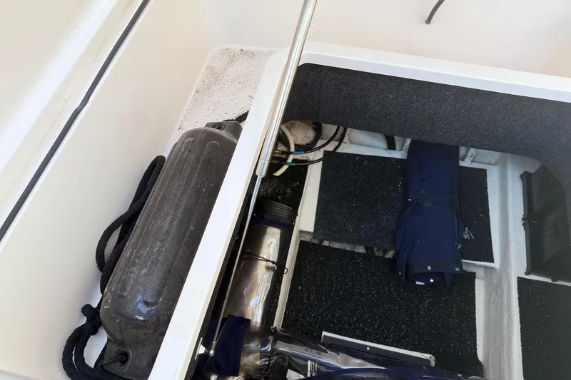 Slide: The Image of 2020 Regal 26 XO boat storage compartment with equipment and accessories. - 25