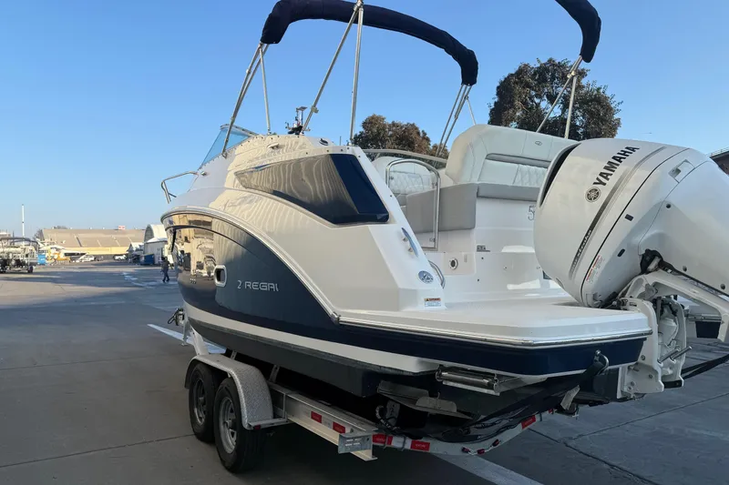 Slide: The Image of 2020 Regal 26 XO boat with Yamaha engine on trailer, dockside view. - 5