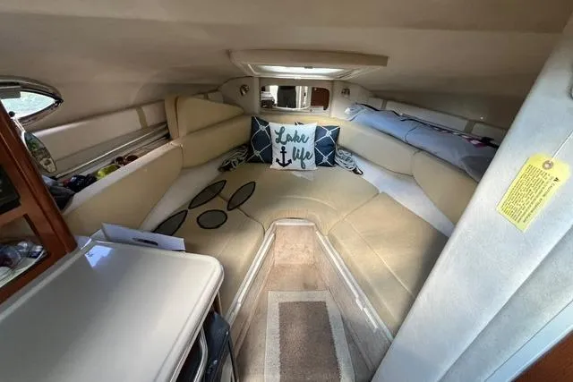 Slide: The Image of Interior of 2008 Sea Ray 240 Sundancer with cozy seating and decorative pillows. - 18