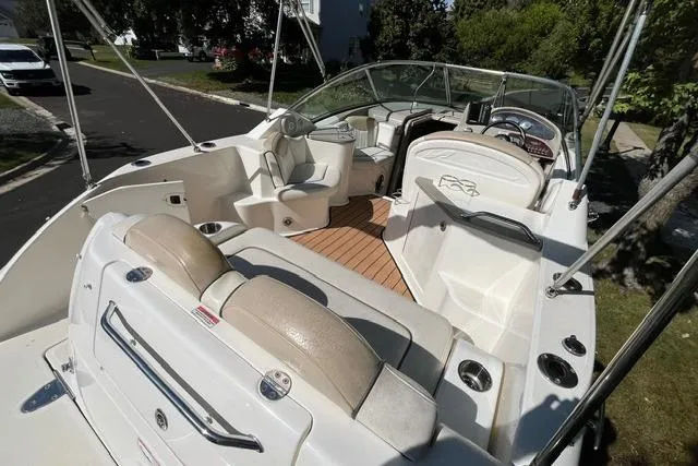 Slide: The Image of 2008 Sea Ray 240 Sundancer boat with spacious seating and sleek design. - 6