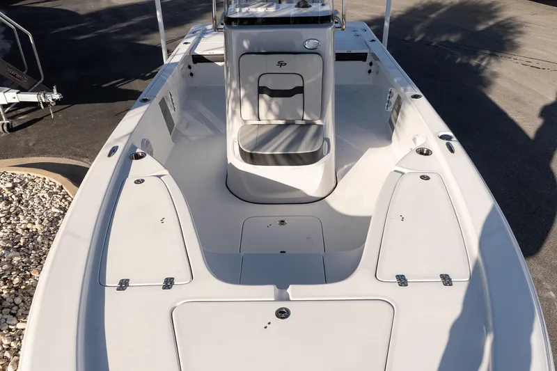 Slide: The Image of 2026 Sea Pro 230 Bay boat interior with seating and storage compartments. - 14