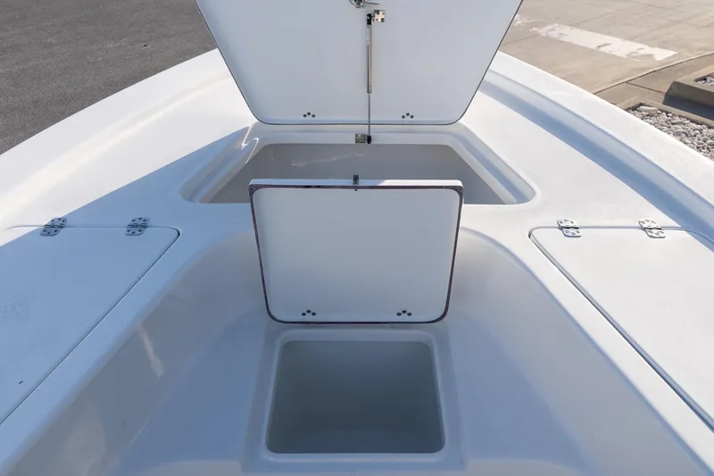 Slide: The Image of 2026 Sea Pro 230 Bay boat storage compartments open on deck. - 16