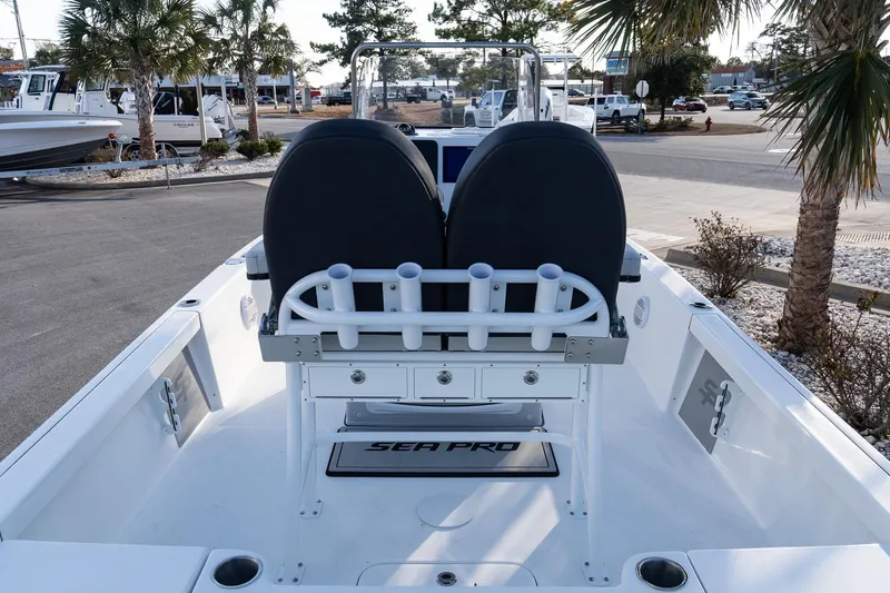Slide: The Image of 2026 Sea Pro 230 Bay boat interior with dual seats and rod holders. - 7