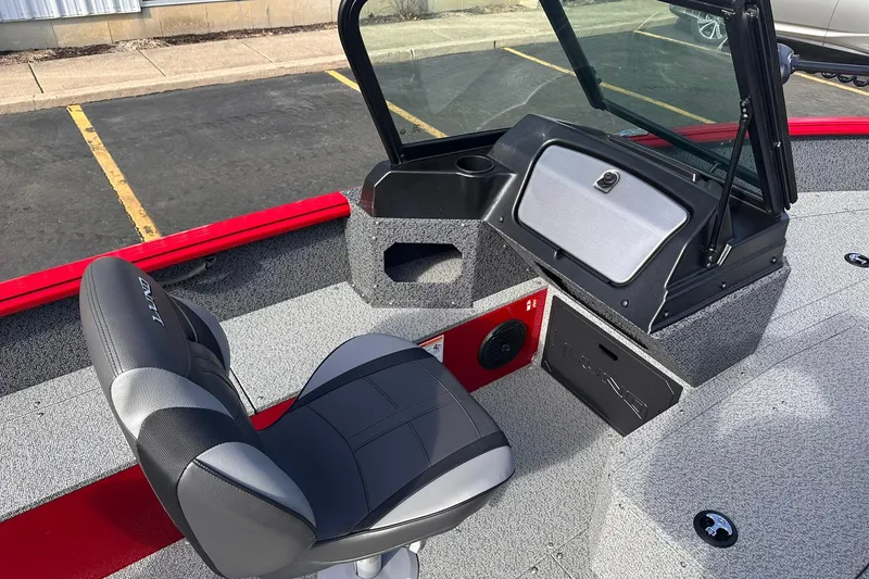 Slide: The Image of 2026 Lund 1800 Explorer Sport boat interior with seating and dashboard. - 12