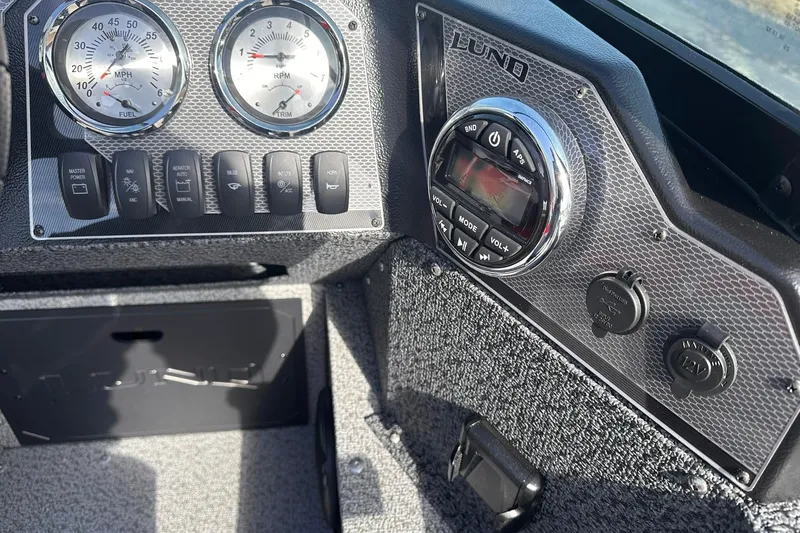 Slide: The Image of Dashboard of 2026 Lund 1800 Explorer Sport boat with gauges and controls. - 21