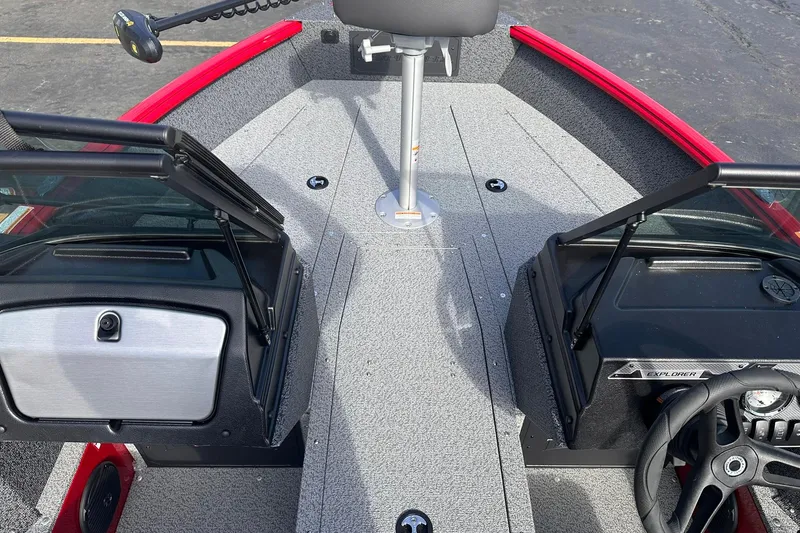 Slide: The Image of 2026 Lund 1800 Explorer Sport boat interior with steering wheel and seating. - 9