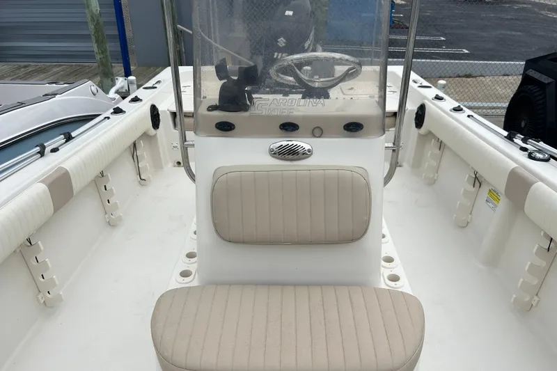 Slide: The Image of 2013 Carolina Skiff 19 Ultra Elite boat interior with steering console and seating. - 10