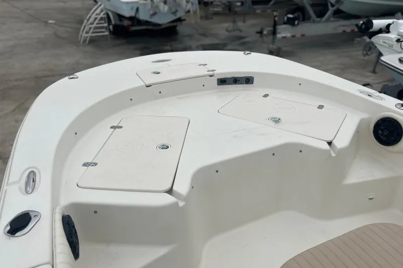 Slide: The Image of 2013 Carolina Skiff 19 Ultra Elite boat deck with storage compartments. - 19