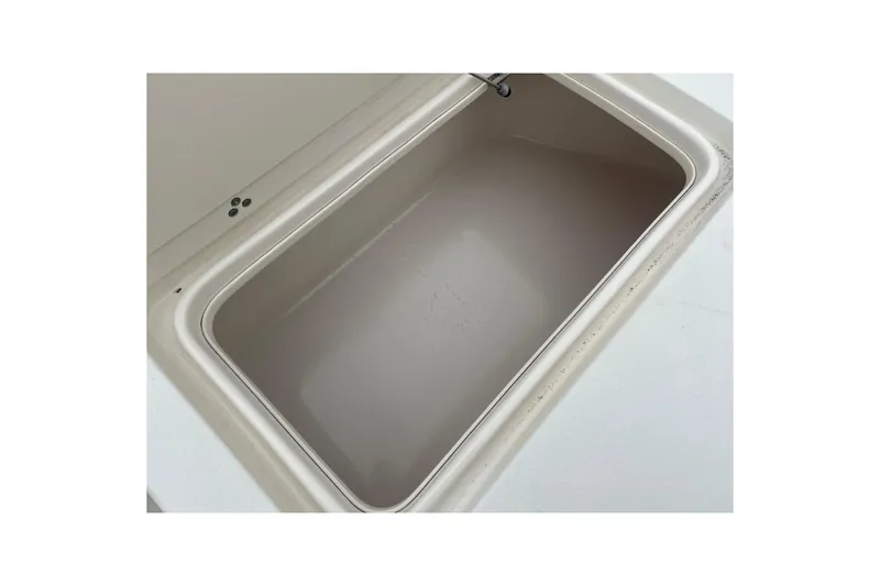 Slide: The Image of Storage compartment of 2013 Carolina Skiff 19 Ultra Elite boat, open and empty. - 21