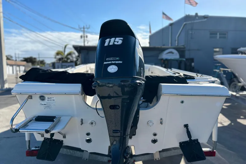 Slide: The Image of 2013 Carolina Skiff 19 Ultra Elite boat with 115 HP outboard motor. - 4