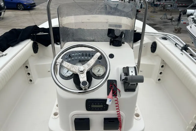 Slide: The Image of 2013 Carolina Skiff 19 Ultra Elite boat console with steering wheel and controls. - 5
