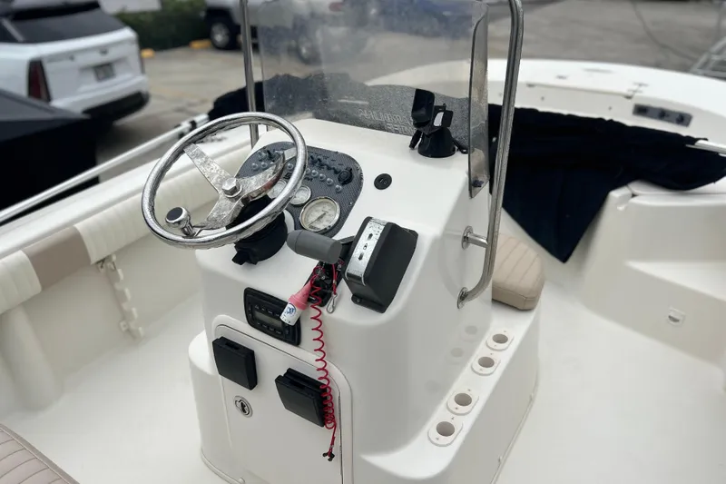 Slide: The Image of 2013 Carolina Skiff 19 Ultra Elite boat console with steering wheel and controls. - 8