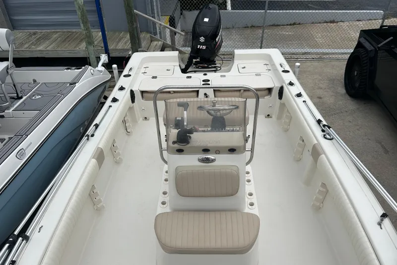 Slide: The Image of 2013 Carolina Skiff 19 Ultra Elite boat interior with console and seating. - 9