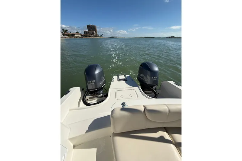 Slide: The Image of 2017 World Cat 230 SD boat with twin 115 engines on calm water. - 15