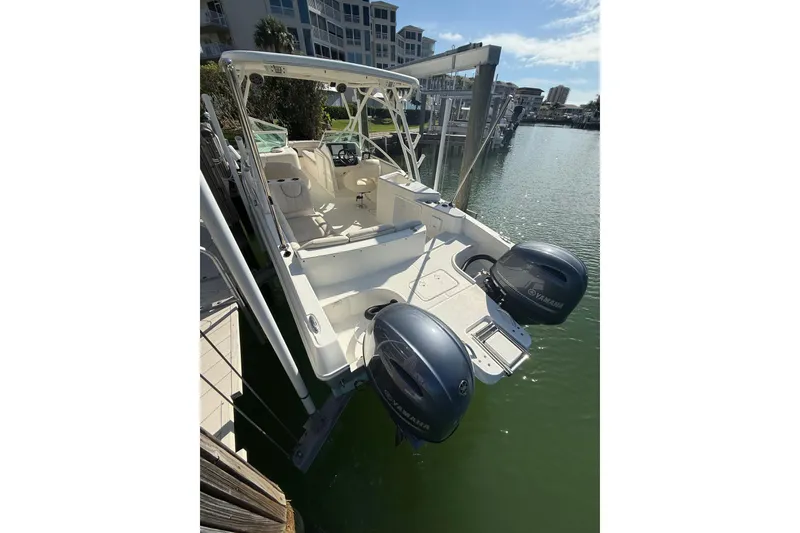 Slide: The Image of 2017 World Cat 230 SD boat docked with dual Yamaha engines. - 2