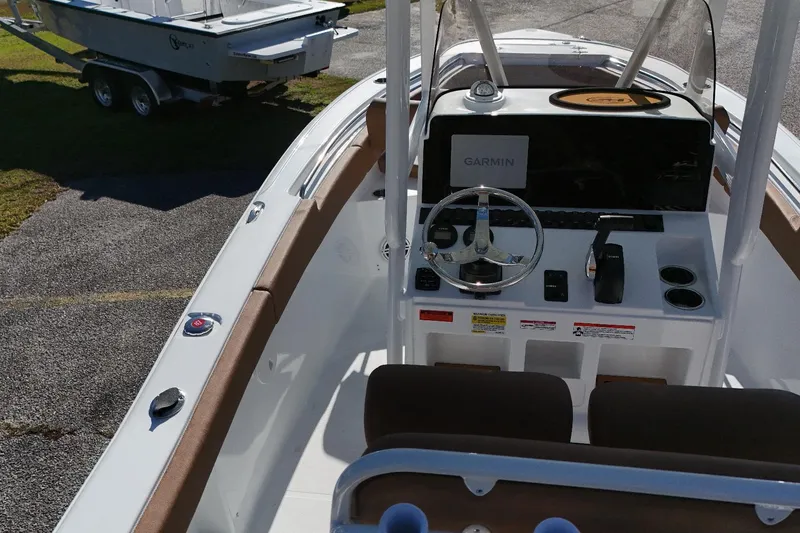 Slide: The Image of 2026 Sea Hunt Ultra 219 boat interior with Garmin navigation system and steering console. - 10