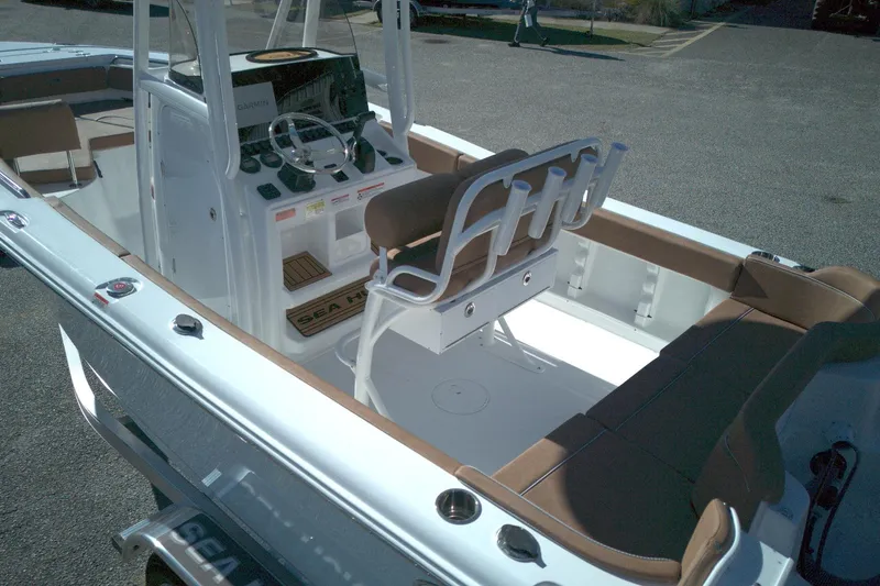Slide: The Image of 2026 Sea Hunt Ultra 219 boat interior with helm, seating, and console. - 2