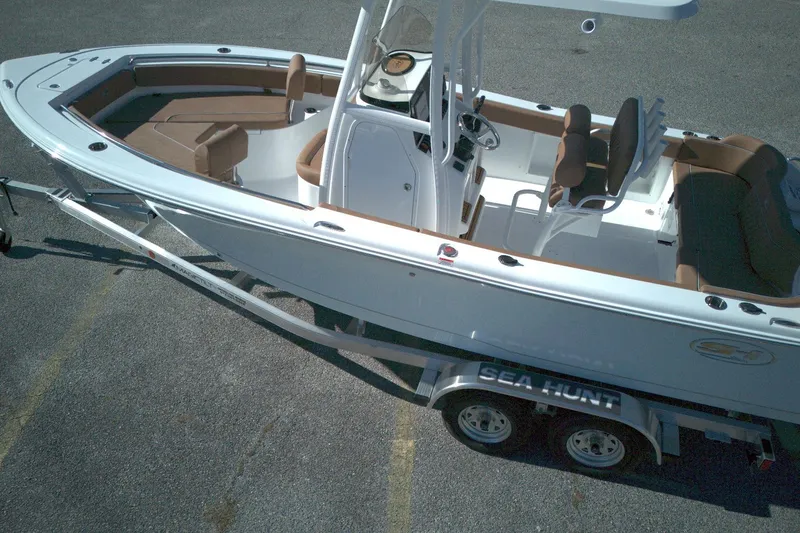 Slide: The Image of 2026 Sea Hunt Ultra 219 boat on trailer, featuring spacious seating and modern design. - 4