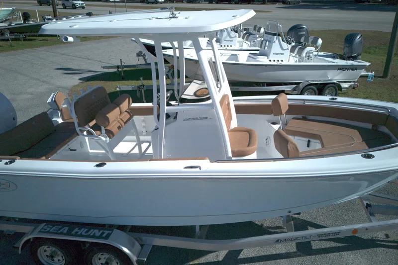 Slide: The Image of 2026 Sea Hunt Ultra 219 boat on trailer, featuring sleek design and spacious seating. - 7