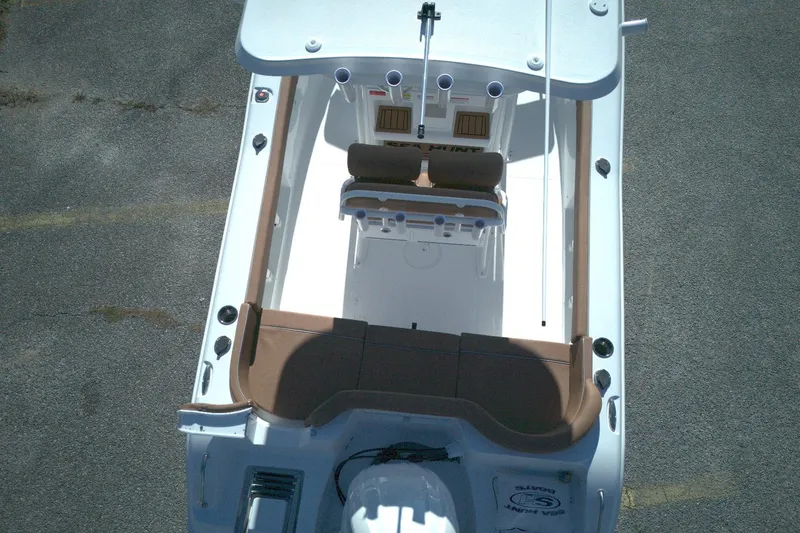 Slide: The Image of Overhead view of 2026 Sea Hunt Ultra 219 boat with brown seating and white deck. - 9