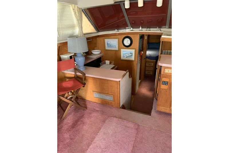 Slide: The Image of Interior of 1988 Silverton 34 Convertible yacht with cozy furnishings and decor. - 7