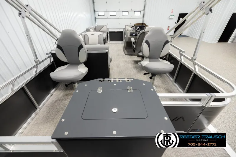 Slide: The Image of 2026 Avalon VEN RF boat interior with modern seating and control panel in a showroom. - 16