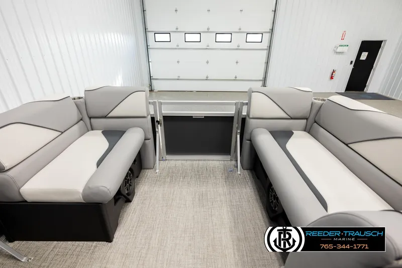 Slide: The Image of Interior of 2026 Avalon VEN RF boat with stylish seating in a showroom. - 18