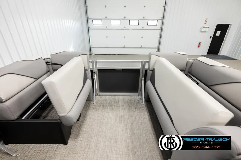Slide: The Image of 2026 Avalon VEN RF boat interior with gray seating in a showroom. - 19
