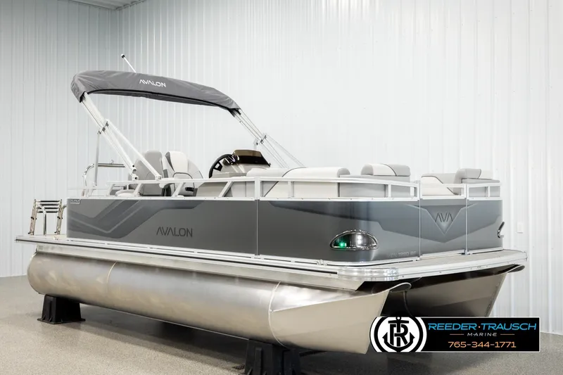 Slide: The Image of 2026 Avalon VEN RF pontoon boat in showroom, featuring sleek design and modern amenities. - 2