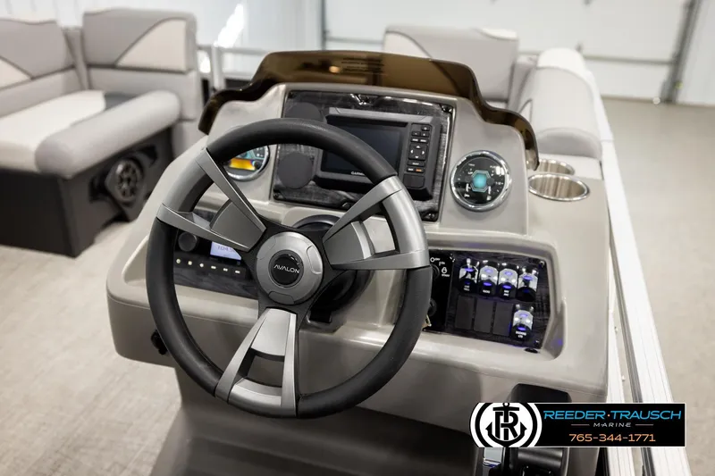 Slide: The Image of 2026 Avalon VEN RF boat dashboard with steering wheel and control panel in a modern interior. - 28
