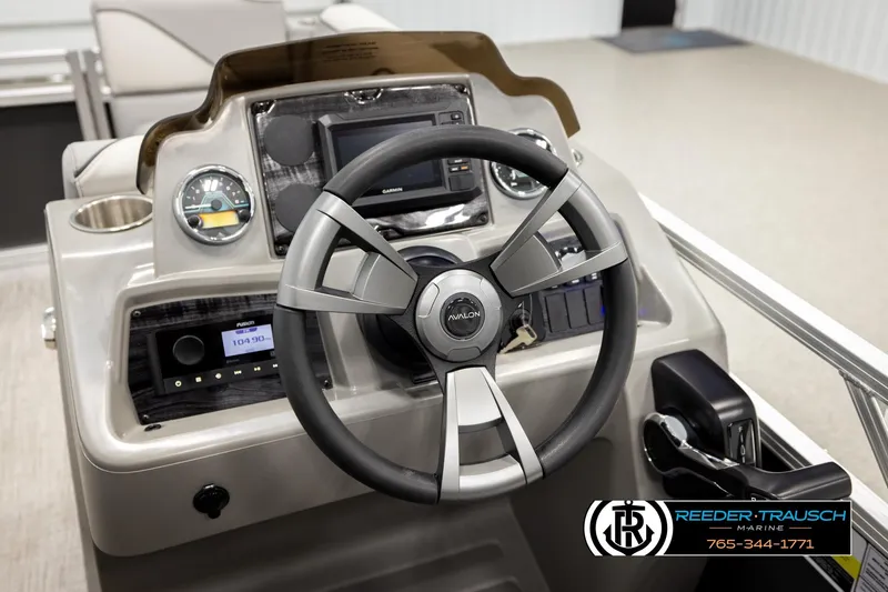 Slide: The Image of 2026 Avalon VEN RF boat dashboard with steering wheel and control panel. - 29