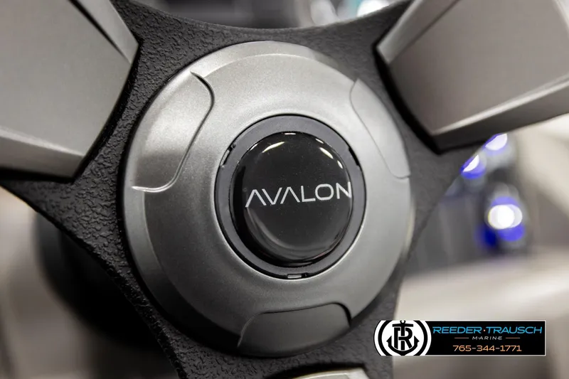Slide: The Image of Steering wheel of 2026 Avalon VEN RF with Reeder-Trausch Marine branding. - 30