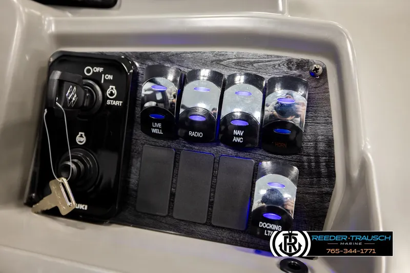 Slide: The Image of Control panel of 2026 Avalon VEN RF boat with switches and ignition key. - 35