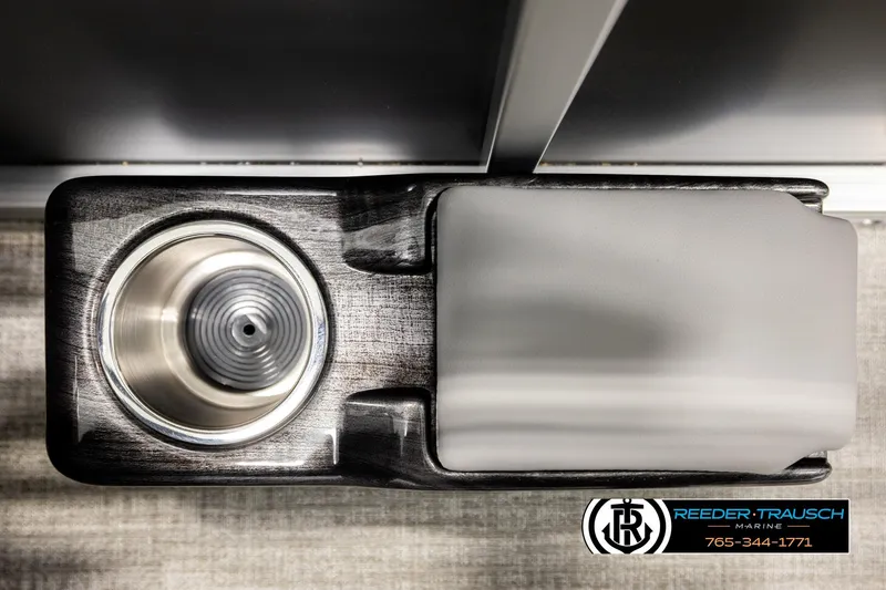 Slide: The Image of 2026 Avalon VEN RF cup holder and armrest detail, Reeder-Trausch Marine branding visible. - 41