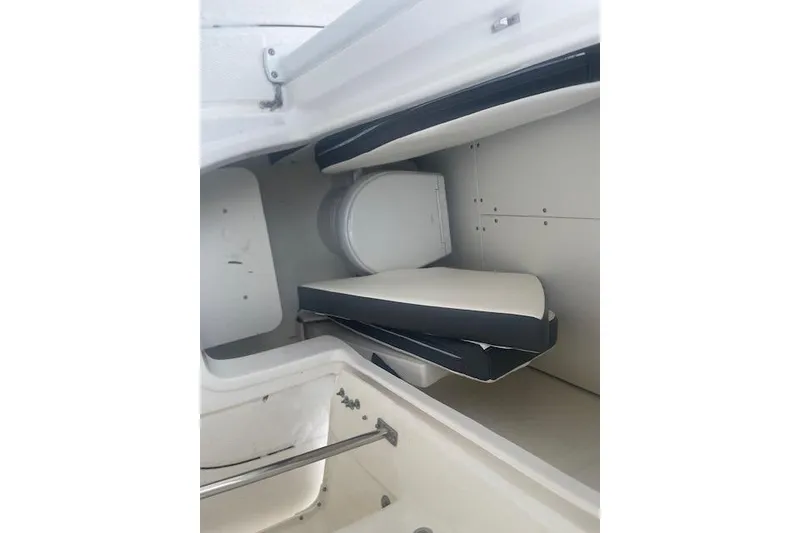 Slide: The Image of 2024 Robalo R230 Center Console interior with seating and storage area. - 6