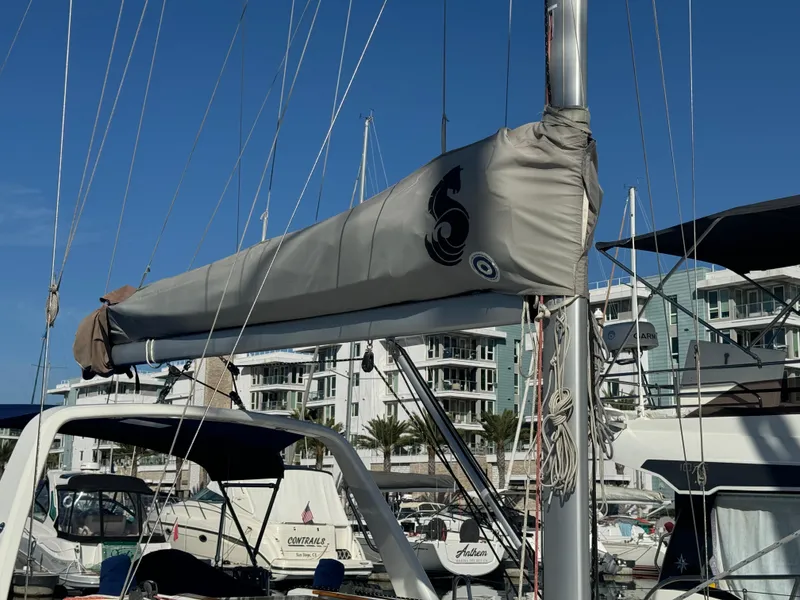 Slide: The Image of Beneteau Oceanis 35.1 sailboat, 2021 model, docked in a marina with modern buildings. - 13