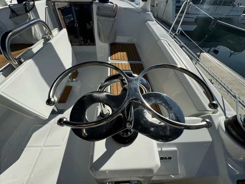 Slide: The Image of Cockpit of 2021 Beneteau Oceanis 35.1 sailboat with modern steering wheel design. - 17