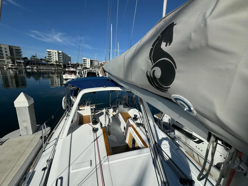 Slide: The Image of Beneteau Oceanis 35.1 sailboat docked in marina, 2021 model, clear blue sky. - 21