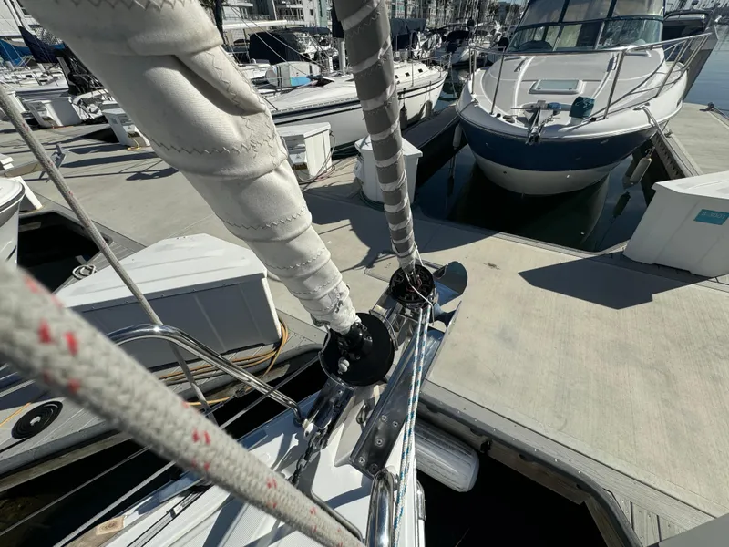 Slide: The Image of Beneteau Oceanis 35.1 sailboat docked at marina, 2021 model, with visible rigging and deck. - 22