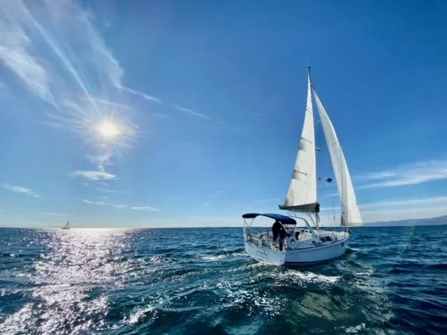 Slide: The Image of Sailing yacht Beneteau Oceanis 35.1, 2021 model, gliding on sunny ocean waters. - 3