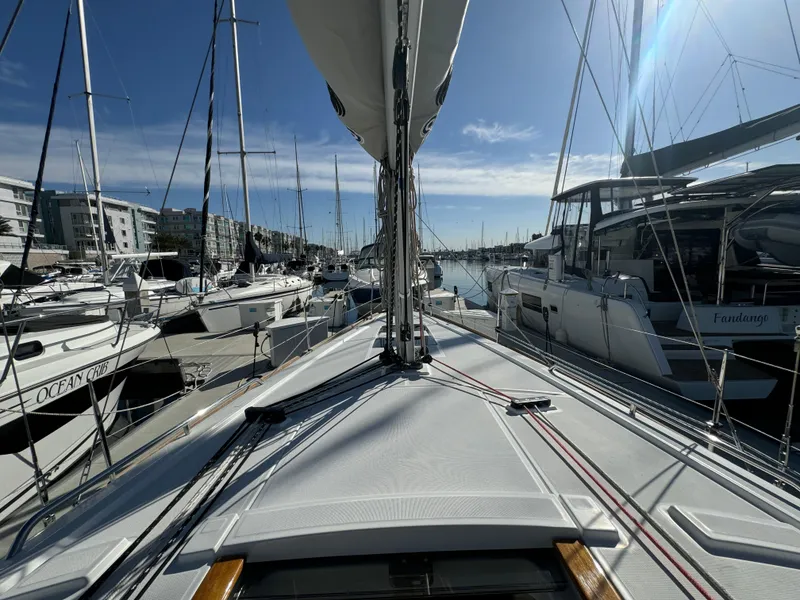 Slide: The Image of Beneteau Oceanis 35.1 sailboat docked in a marina, 2021 model, sunny day. - 30