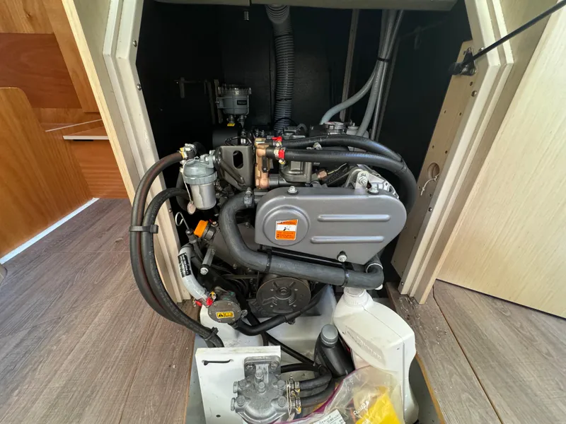 Slide: The Image of Engine compartment of a 2021 Beneteau Oceanis 35.1 sailboat, showcasing detailed mechanical components. - 37