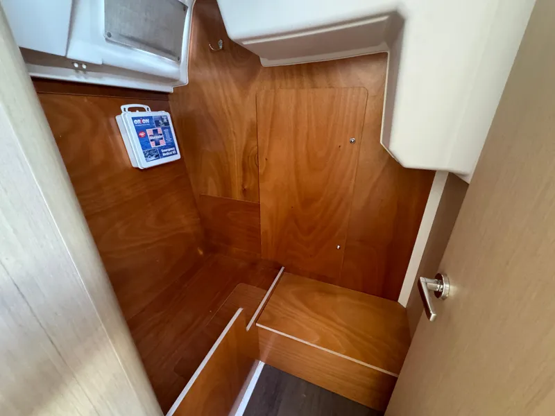 Slide: The Image of Interior cabin of 2021 Beneteau Oceanis 35.1 sailboat with wooden finish. - 43