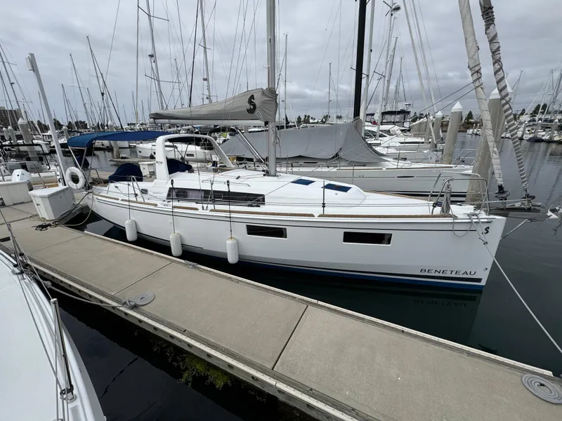 Slide: The Image of 2021 Beneteau Oceanis 35.1 sailboat docked in marina, overcast sky. - 5