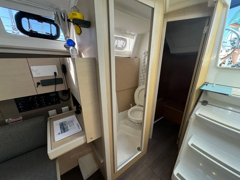 Slide: The Image of Interior of 2021 Beneteau Oceanis 35.1 yacht showing bathroom and navigation area. - 52