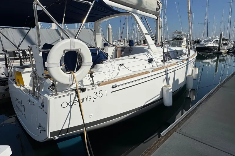 Slide: The Image of 2021 Beneteau Oceanis 35.1 sailboat docked in marina, rear view. - 57